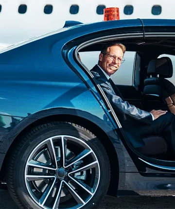 Executive traveler in premium chauffeured vehicle