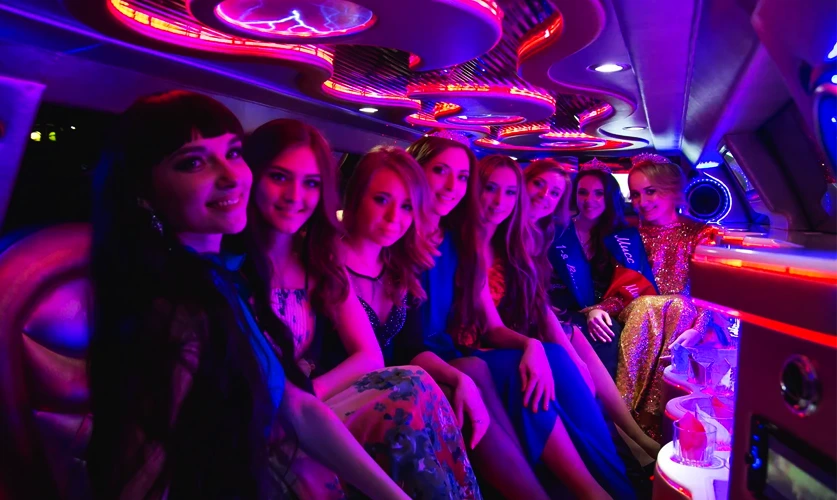 Chauffeur assisting prom night passengers